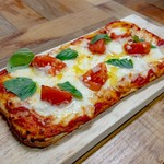 Margherita pizza with fresh tomatoes and mozzarella