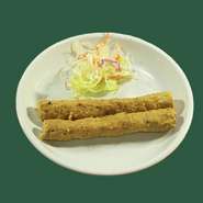 ポークの挽き肉を串にまきつけ焼き上げたもの