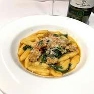 Homemade Cavallietti pasta with homemade veal sausage and rucola