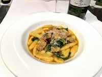 Homemade Cavallietti pasta with homemade veal sausage and rucola