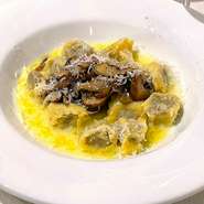 Handmade Italian chestnut ravioli with mushrooms and butter parmesan