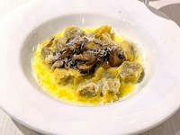 Handmade Italian chestnut ravioli with mushrooms and butter parmesan