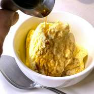 Homemade vanilla ice cream topped with espresso cake
