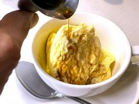 Homemade vanilla ice cream topped with espresso cake
