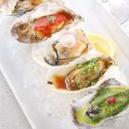 グリルオイスターは、生牡蠣の美味しさとはまた一味違う味わい。ソースは、10種類の中から、5種類をお好みで。