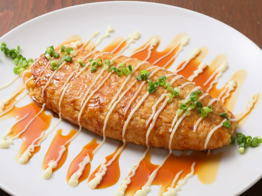 フワトロ食感と卵の濃厚なコクがたまらない『酒場のオムライス』