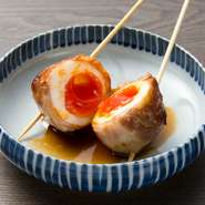 地元のうまい卵・蘭王を使った「半熟玉トロ豚焼き串」