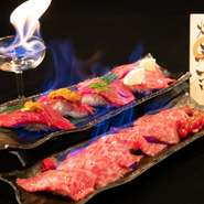 注文率100％！話題の肉寿司が炎に包まれる大人気の"焔立つ肉寿司"※肉寿司は2貫付きになります。
焔の演出があるのは階段盛り以外です。階段盛りで演出をご希望の際には、通常のお皿でのご提供となります。