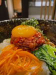 山形牛のもも肉を使用したユッケを石焼ビビンバの上に贅沢に乗せて最高の一品に・・・