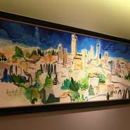 食器は滋賀県の陶芸家の作品を使用。シェフが一目ぼれした器で、優雅にお食事を楽しんでみませんか。壁面には渡伊時代の思い出を描いて貰ったという風景画が飾られ、ゲストを温かく出迎えます。