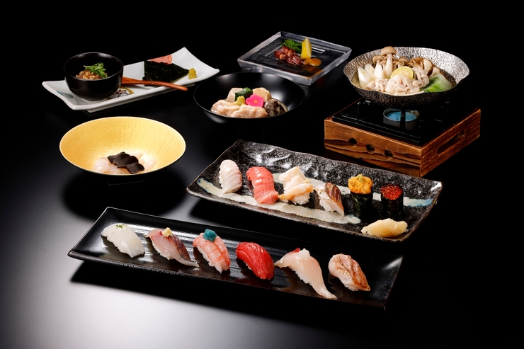 享用包含著名地布煮和黑喉海鲈鱼在内的12件高级寿司套餐，价格为12800日元（含税）。