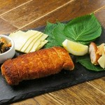 ~Pork cutlet wrapped in prosciutto, served with perilla leaves~