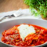 Pasta with Bacon.onions.Ricotta cheese and tomato sauce.