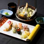 新鮮な旬の魚介を使用した握り寿司と、揚げたての天ぷらを一度に楽しめる御膳です。（握り寿司８貫、天ぷら盛り合わせ、小鉢、赤出汁、水物）