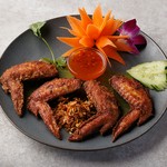 ナンプラーとニンニクの風味が効いた、甘辛いたれに漬け込みじっくりと焼き上げた一品