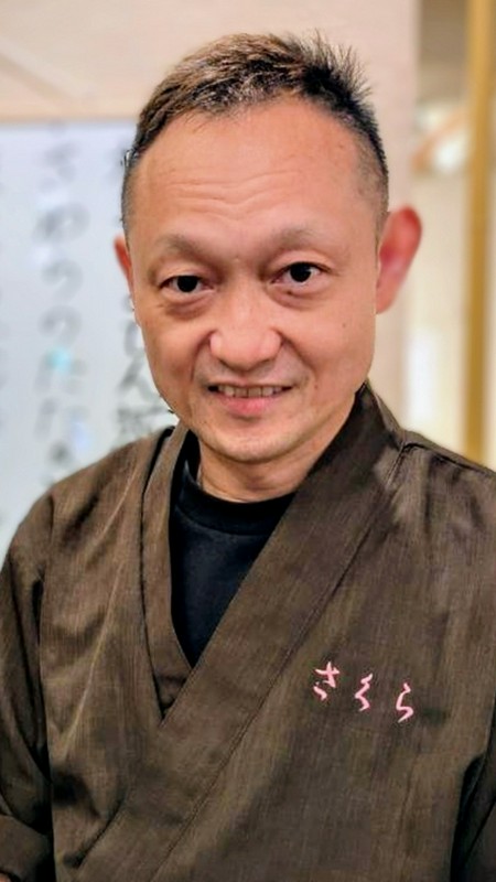 飯田　健二 氏
