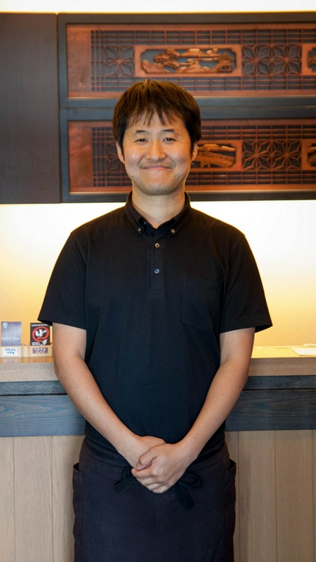 金岡　元一 氏