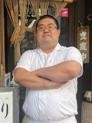 與那覇　貴雄 氏