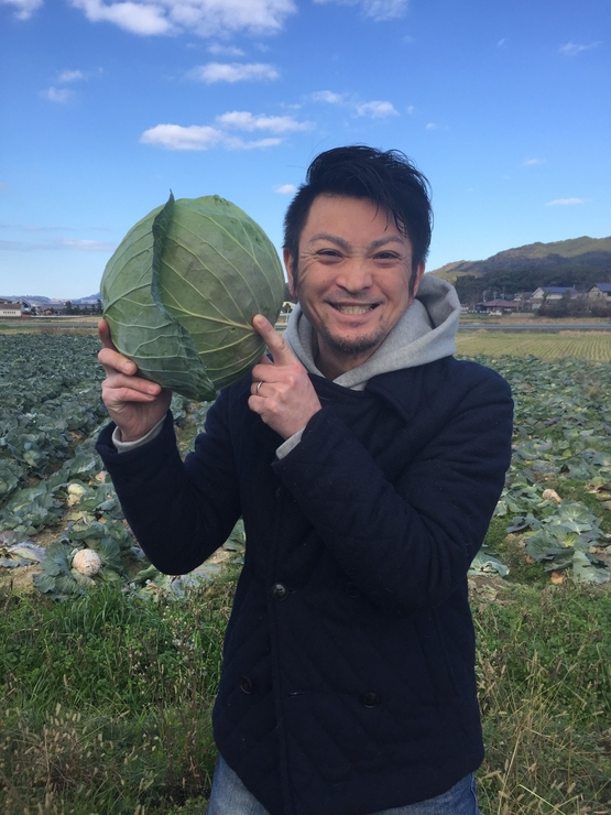 梯　英二 氏