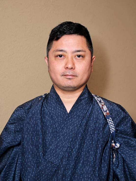 城間　孝文 氏