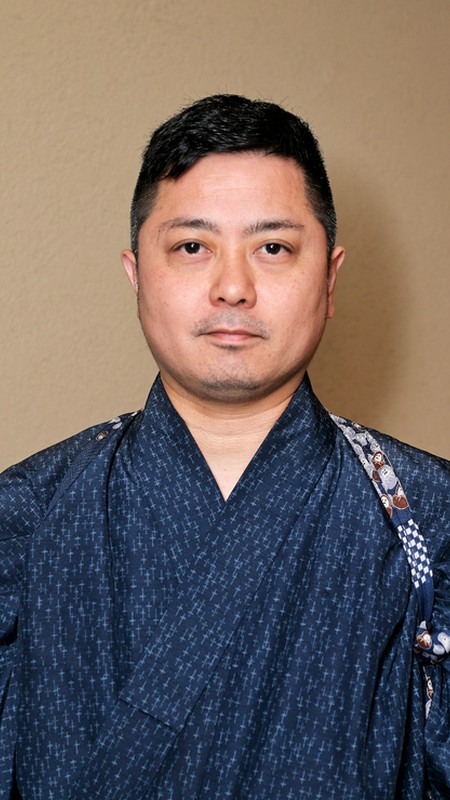 城間　孝文 氏