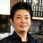 新明　賢司